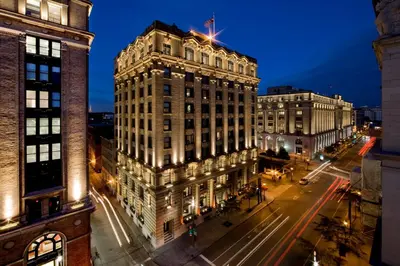 a tall building on a city street at night at Hotel St Paul, Montreal, a Member of Design Hotels in Montréal