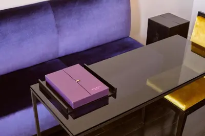 a purple box sitting on top of a table at Hotel St Paul, Montreal, a Member of Design Hotels in Montréal