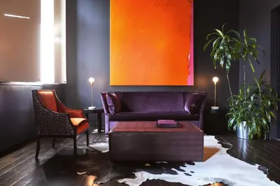 a living room with a couch and a chair at Hotel St Paul, Montreal, a Member of Design Hotels in Montréal
