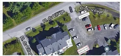 an overhead view of a parking lot with cars at Le Philémon Club Azur plage Memphrémagog in Magog-Orford