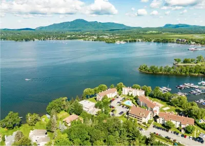 an aerial view of a resort on a lake at Magog Waterfront Studio 106 in Magog-Orford