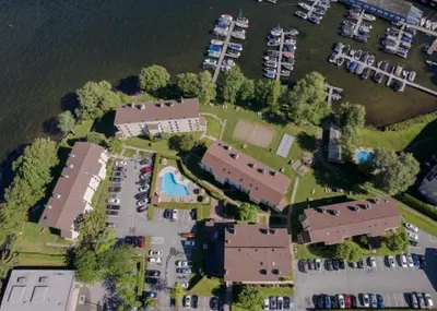 an aerial view of a marina with a bunch of buildings at Magog Waterfront Studio 106 in Magog-Orford
