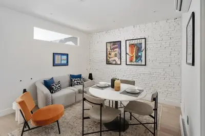 a living room with a table and a couch at François-Denis Apartments in Montréal