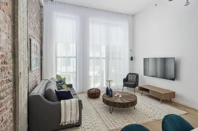 a living room with a couch and a table at Bakan - Sainte Catherine in Montréal