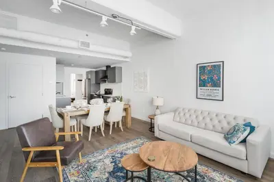 a living room with a couch and a table at Bakan - Sainte Catherine in Montréal