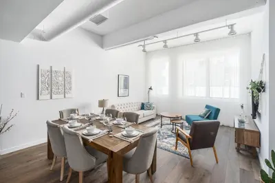 a dining room with a table and chairs at Bakan - Sainte Catherine in Montréal