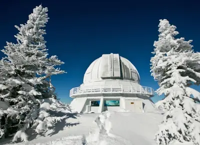 an observatory in the snow with snow covered trees at Bel appartement A la croisée des sommets in Notre-Dame-Des-Bois