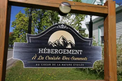 a sign for a residence in front of a house at Bel appartement A la croisée des sommets in Notre-Dame-Des-Bois