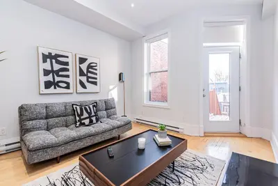 a living room with a couch and a coffee table at New classy 2 bedroom apartment in Le Plateau by DenStays in Montréal
