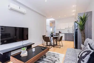 a living room with a large flat screen tv at New classy 2 bedroom apartment in Le Plateau by DenStays in Montréal
