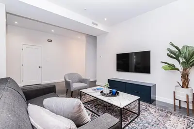 a living room with a couch and a table at Massive 3 bedroom apartment in the hearth of Le Plateau by DenStays in Montréal