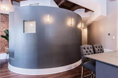 a meeting room with a blue wall and chairs at Family Friendly 3-bedroom beauty in Le Plateau by DenStays in Montréal