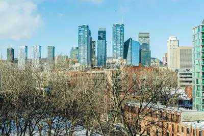 a view of a city skyline with tall buildings at WERFY Luxury Apart-Hotel in Montréal