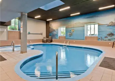 a pool in the middle of a hotel room at Magog Waterfront Condo in Magog-Orford