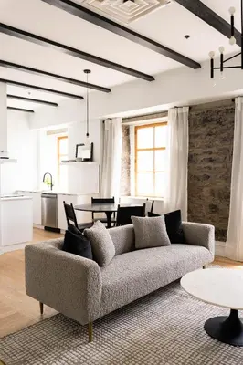a living room with a couch and a table at Maison Rasco by Luxury In Transit in Montréal