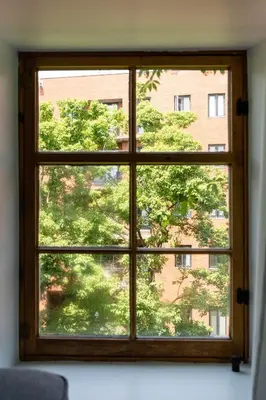 a window with a view of a building at Maison Rasco by Luxury In Transit in Montréal
