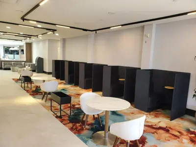 a conference room with white tables and chairs at Radisson Hotel Montreal Airport in Saint-Laurent