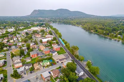 an aerial view of a town next to a river at Nice River & Mountain View+4 Beds+Free parking in McMasterville