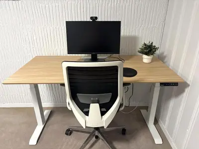 a computer monitor sitting on top of a wooden desk at Montreal - Laval Haven - Entire Rental Unit in Laval