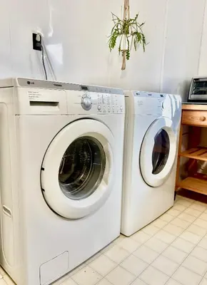 a washing machine and a dryer in a kitchen at Montreal - Laval Haven - Entire Rental Unit in Laval