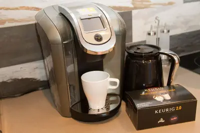 a coffee maker sitting on a counter with a cup at MtlVacationRentals - MTL ZOO in Montréal