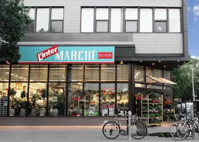 a store front of a market with bikes parked outside at MtlVacationRentals - MTL ZOO in Montréal