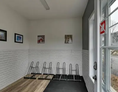 a room with three chairs lined up against a wall at Superbe condo - Navette de Ski Gratuite #202 in Bromont