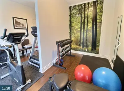 a room with a gym with exercise equipment and a window at Superbe condo - Navette de Ski Gratuite #202 in Bromont