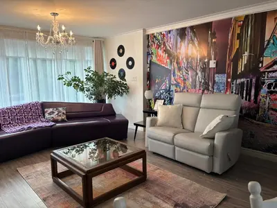 a living room with a couch and a coffee table at Le Vétérans , Au Cœur du Centre-Ville , Tout à Pied ! in Lac-Mégantic