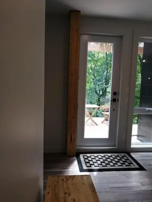 a room with a door leading to a patio at loft in the mountains, near Bromont in Shefford
