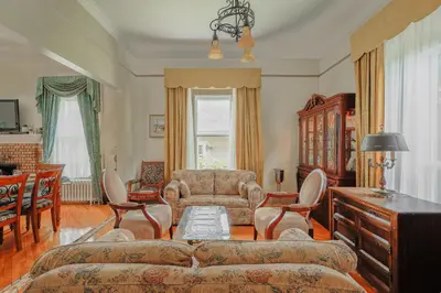 a living room with a couch and a chair at Chez l'Doc in Saint-Prosper