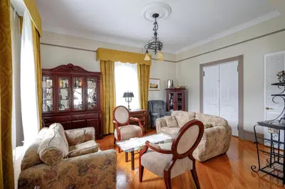 a living room with a couch and chairs and a table at Chez l'Doc in Saint-Prosper
