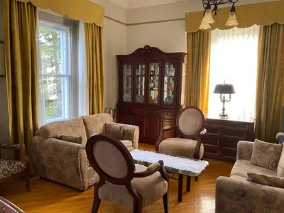 a living room with a couch and chairs and a table at Chez l'Doc in Saint-Prosper