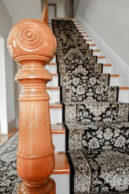a wooden rail next to a spiral staircase at Chez l'Doc in Saint-Prosper