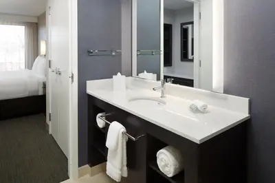 a bathroom with a sink and a mirror at Residence Inn Montreal Midtown in Montréal