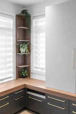 a kitchen with dark wood cabinets and windows at Le Sainte-Marie - Vieux-Terrebonne in Terrebonne