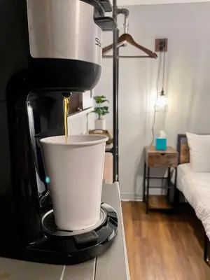 a coffee maker sitting on top of a counter at Grand Central Hotel Richmond in Richmond