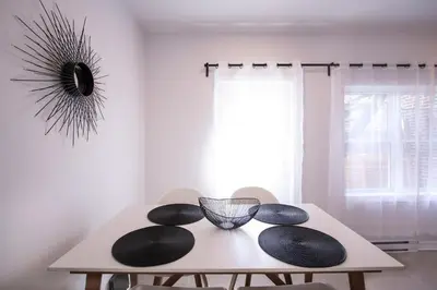 a white table with two chairs and a mirror at BLUE&GOLD - SelfCheckIn - Plateau - St-Laurent in Montréal