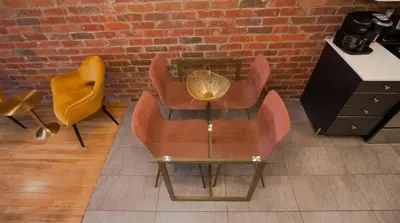 a room with two chairs and a table and a brick wall at GATSBY - SelfCheckIn - Rooftop - Terraces - St-Denis in Montréal