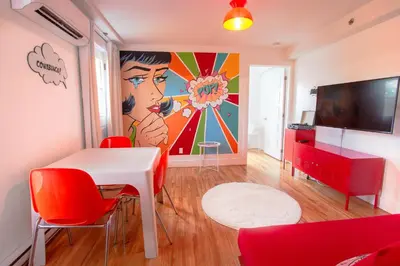 a living room with a painting on the wall at POP - SelfCheckIn - Rooftop - Terraces - St-Denis in Montréal
