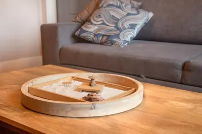 a wooden table with a clock on top of a table at ZEN - SelfCheckIn - Rooftop - Terraces - St-Denis in Montréal