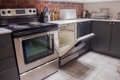 a kitchen with a stove and an oven at ZEN - SelfCheckIn - Rooftop - Terraces - St-Denis in Montréal