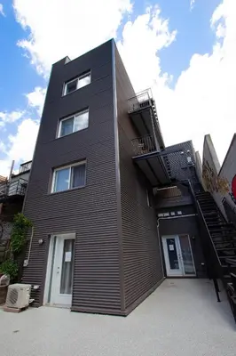 a black building with a staircase on the side of it at ZEN - SelfCheckIn - Rooftop - Terraces - St-Denis in Montréal