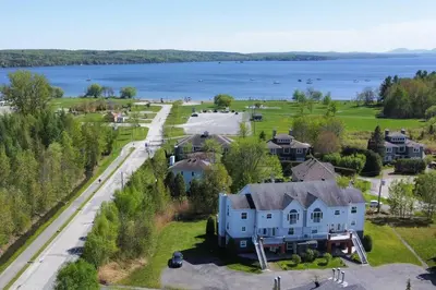 an aerial view of a house and the water at *Nouveauté* Foyer au bois, Plage, Montagne et + in Magog-Orford