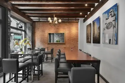 a dining room with a table and chairs at Hotel Épik Montréal in Montréal