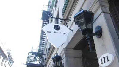 a sign hanging on the side of a building at Hotel Épik Montréal in Montréal