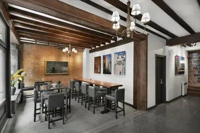 a dining room with a table and chairs at Hotel Épik Montréal in Montréal