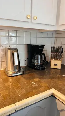 a kitchen counter with a toaster on a counter top at Chalet KLS Lac D'Argent in Eastman