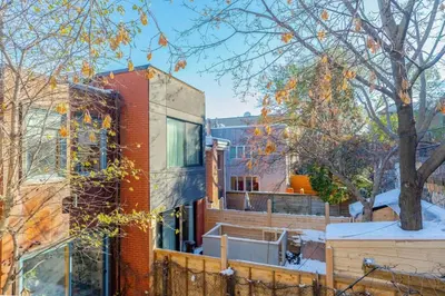 a brick building with a window on the side of it at Luminous and Stylish Renovated Apt in LePlateau in Montréal