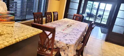 a table and chairs in a room with a table and a table and a table at Lady Eden Waterfront Mansion - No party in Montréal